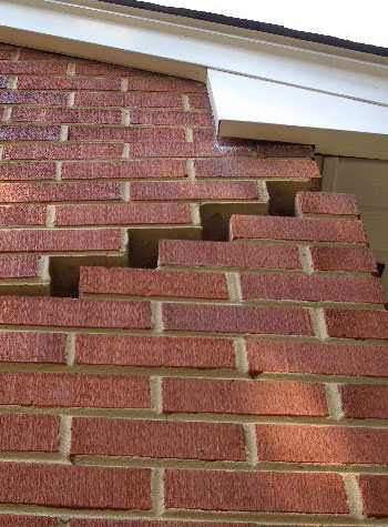 photo of a rotating foundation wall with cracks in Mercer