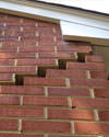 Serious damage to a foundation wall due to settlement of a home in Lake Linden