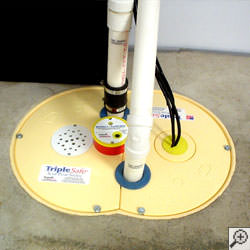 A sump pump system installed along a basement floor in Ashland.