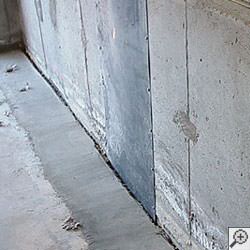 an ugly basement weeping tile drainage system that's clogged and not working in Eagle River.