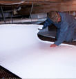 Eagle River insulation being installed in a crawl space.