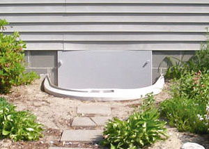 Rigid plastic crawl space access well installed in a Marquette crawl space