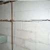 Severe foundation damage from a long crack in a bucking wall of a Crystal Falls home.