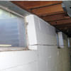 A foundation showing severe inward buckling along the windows in a L'Anse home.