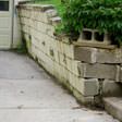 a collapsing retaining wall in Hancock