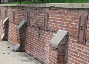 Rusted wall plate anchors in a retaining wall repair in Mercer.