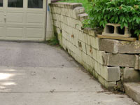 a failing retaining wall around a driveway in Ashland