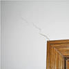 wall cracks along a doorway in a Crystal Falls home.