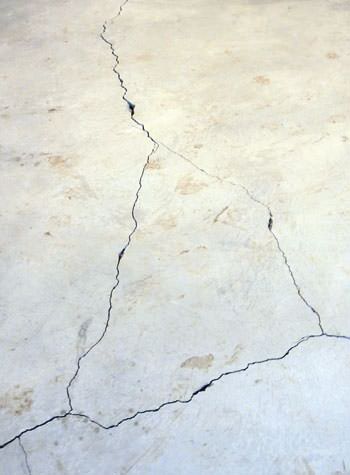 severely cracked, heaving slab floors in a home in Bayfield