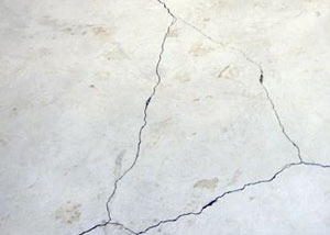 cracks in a slab floor consistent with slab heave in Ontonagon.