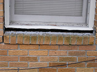 A window sill cracking and separating from the foundation wall in a Hurley home.