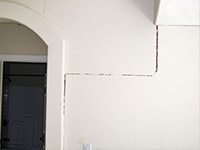 Drywall cracking due to foundation settlement in Baraga