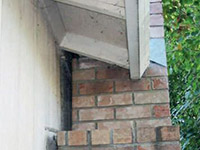 A chimney leaning away from the home on a Chassell foundation