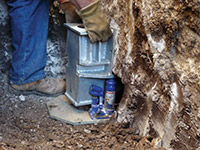 Securing a foundation footing bracket for a foundation repair system in Park Falls.
