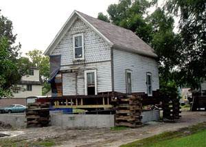 A severely damaged home foundation that is undergoing replacement in Wakefield.
