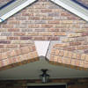 Major tuckpointing on a home archway over a door, with tuckpointing several inches wide that has failed on a Ashland home
