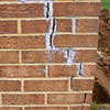 Tuckpointing that cracked due to foundation settlement of a Houghton home