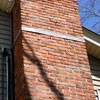 A tilting chimney on a Atlantic Mine home with a leaning, tilting chimney that was temporarily repaired.