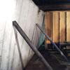 Temporary foundation wall supports stabilizing a Iron Mountain home