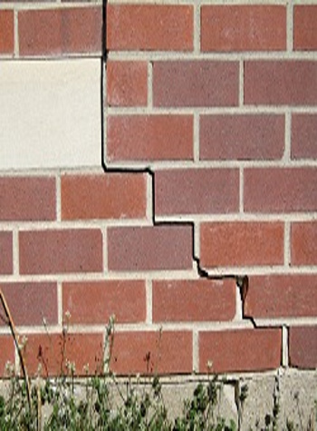 photo of a rotating foundation wall with cracks in Butternut