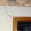 A large settlement crack on interior drywall in a L'Anse home.