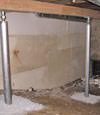 A system of crawl space support posts adding structural support to a crawl space in Saint Germain