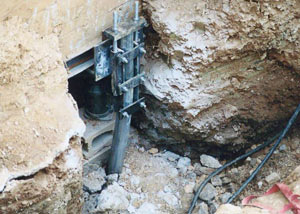 a bent, failed foundation push pier installed in Marquette.