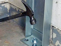 Mounting a foundation channel anchor installation to the floor in Eagle River.