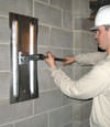 Tightening a wall anchor plate in Iron Mountain, Michigan and Wisconsin