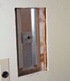 Wall anchor plates installed during a foundation repair in Houghton in a finished basement