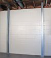 A steel i-beam system installed on a Calumet foundation wall