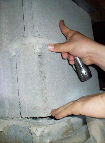 a completely failing concrete crawl space support pillar in Saint Germain