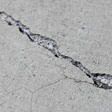 sinking outdoor concrete in need of mudjacking in Ashland