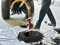 Digging the hole used for wall anchor installation in Hurley.