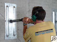 Mounting the steel wall plate for foundation wall repair and straightening in Hurley.