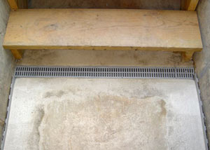 Our grated drain system installed on a leaking basement staircase in Butternut.