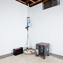 Sump pump system, dehumidifier, and basement wall panels installed during a sump pump installation in Crystal Falls