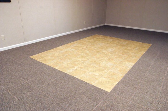 tiled and carpeted basement flooring installed in a Escanaba home