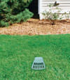 A buried gutter drain downspout extension installed in a Saint Germain home