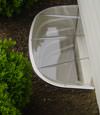 Covered plastic basement window well system