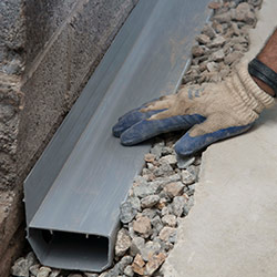 installing a drain tile system in a Chassell home